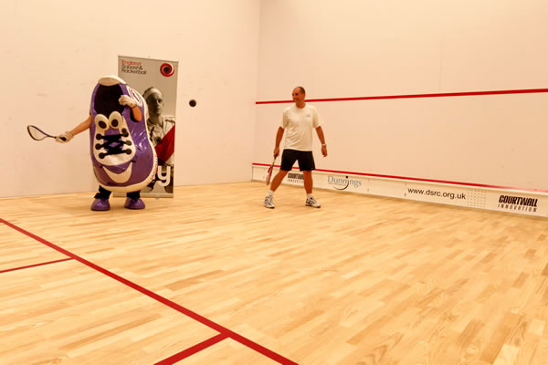 Squash mascot on new courts